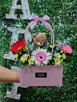 Cartera floral con osita